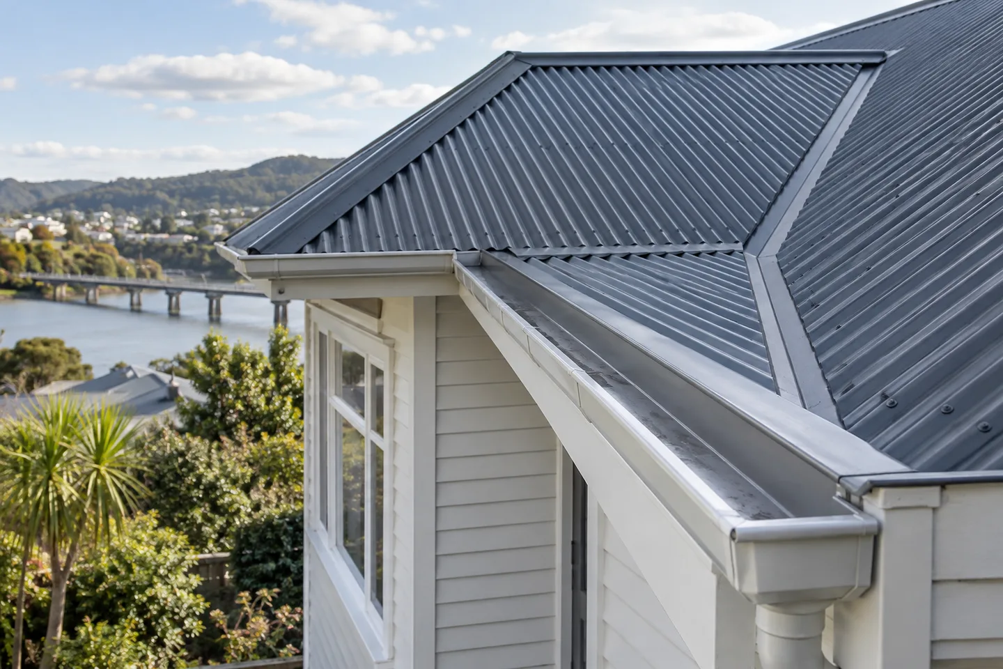 Roofing concept: A metal house roof with visible valley and gutter details