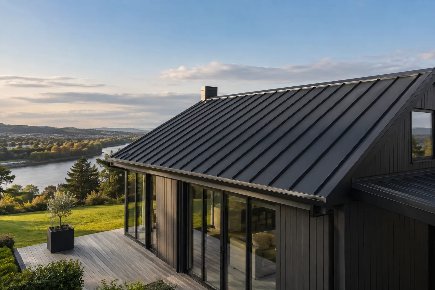 Roofing concept: a modern home with charcoal standing seam roof panels